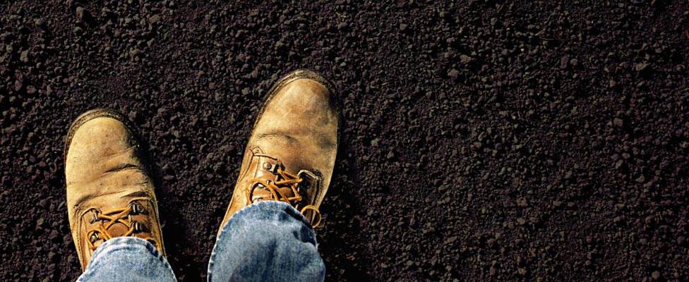 Feet firmly on the ground of new topsoil